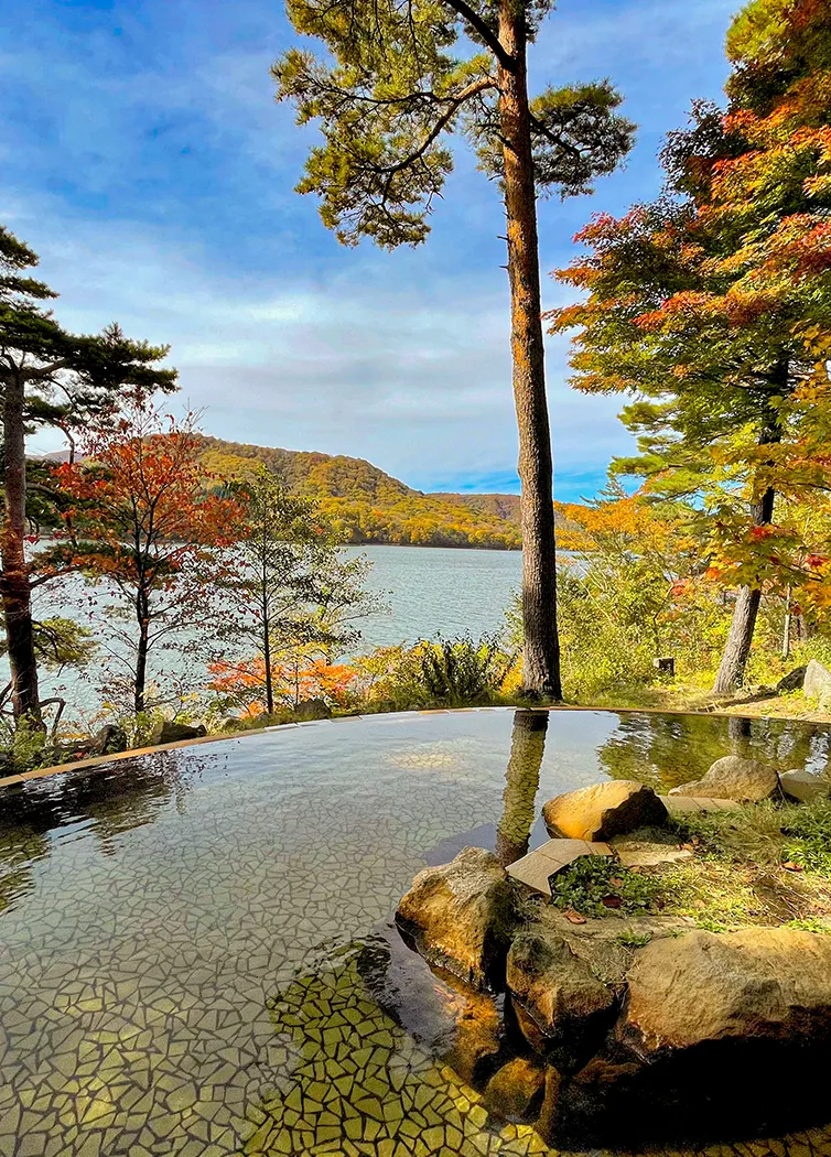 Open-air hot spring bath with water flowing directly from the source.